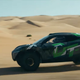 A side profile image of the BMW Dune Taxi on a desert.